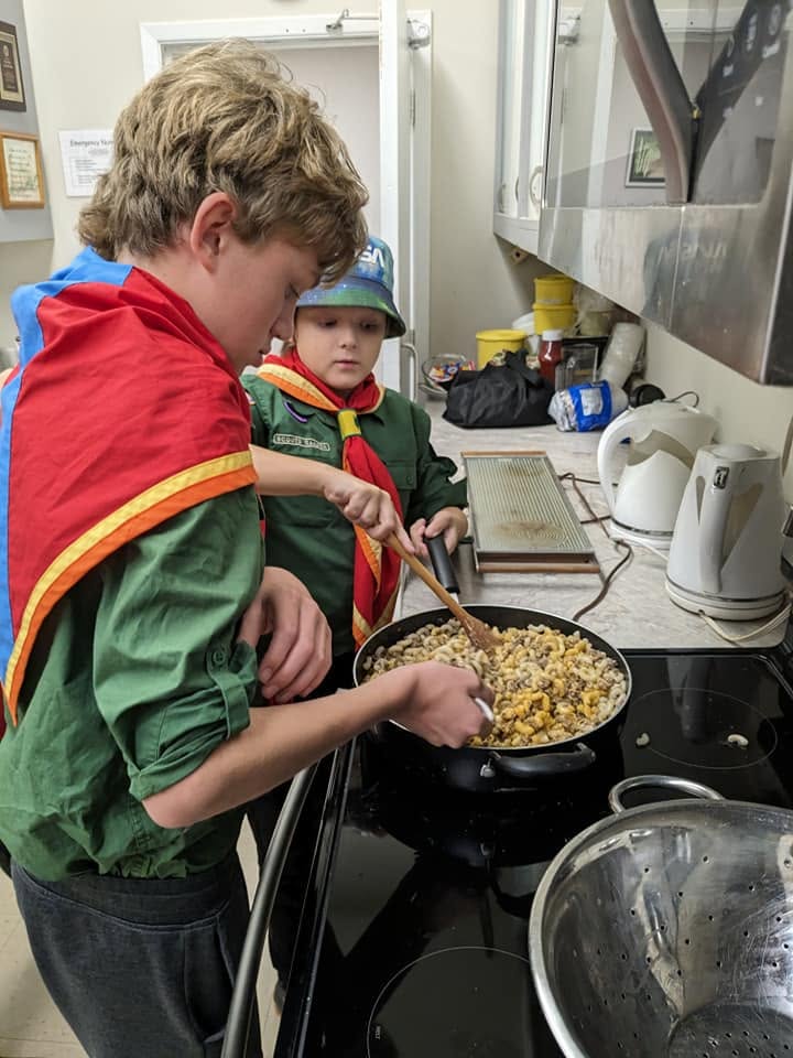 Scouts preparing a meal together