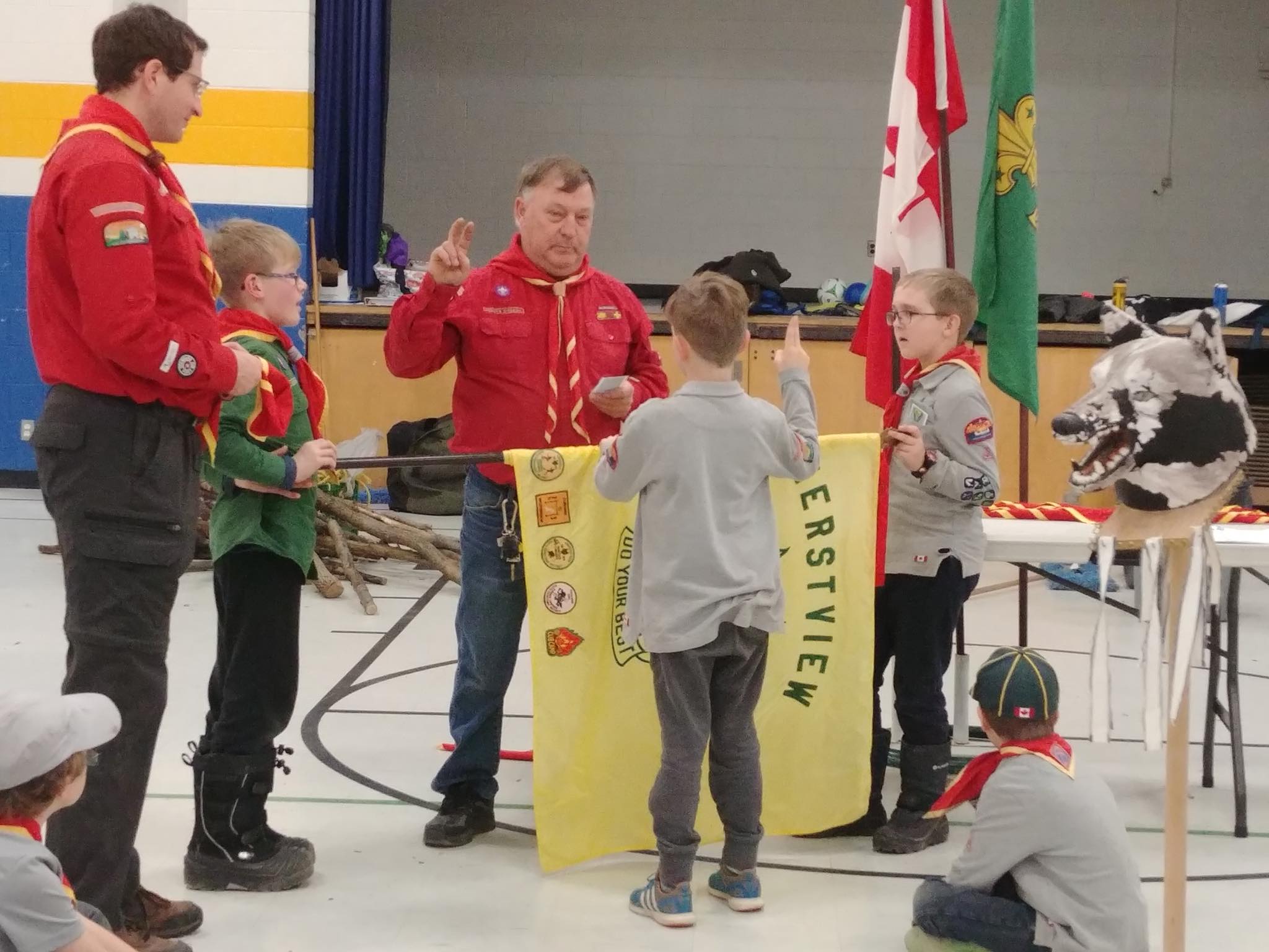 An investiture ceremony at an Amherstview Scout meeting