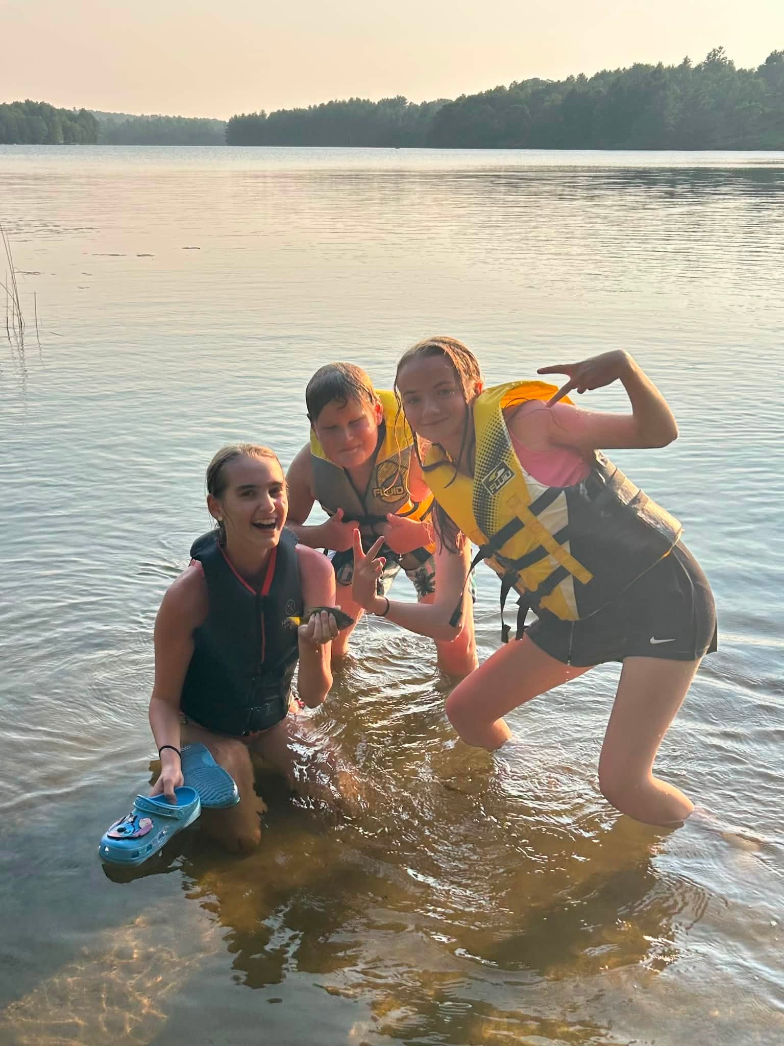 Scouts wearing life jackets at the lake